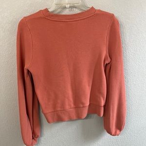 XS Target brand sweater in a reddish orange From non smoking dog friendly home.